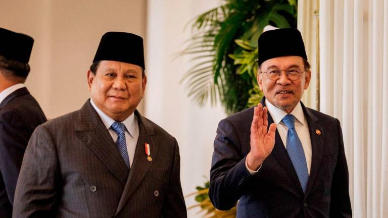 PM Datuk Seri Anwar Ibrahim and Indonesia president Prabowo Subianto - Photo by Yasuyoshi CHIBA / AFP