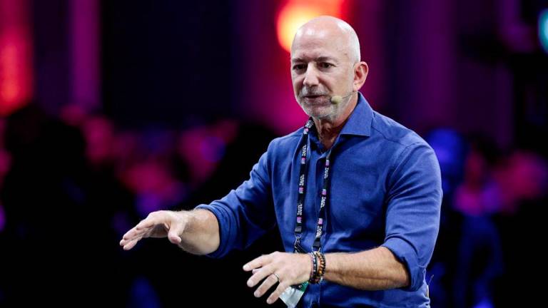 Amazon founder Jeff Bezos gestures as he speaks at the main panel of Italian Tech Week 2025 in Turin, Italy October 3, 2025. - REUTERSPIX