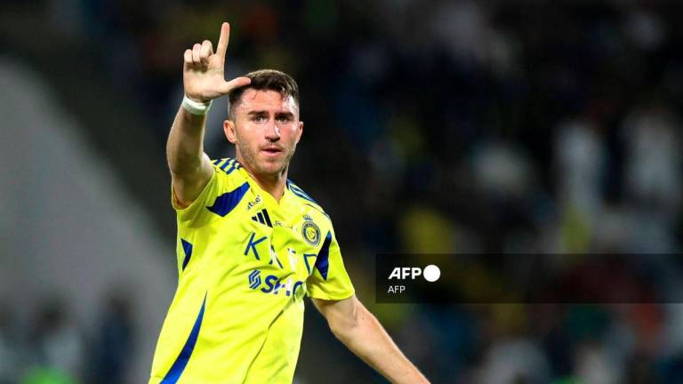 Nassr's French defender #27 Aymeric Laporte celebrates after scoring his team's first goal during the Saudi Pro League football match between Damac and Al-Nassr at Prince Sultan bin Abdulaziz Sports City in Abha on April 22, 2025. - AFP