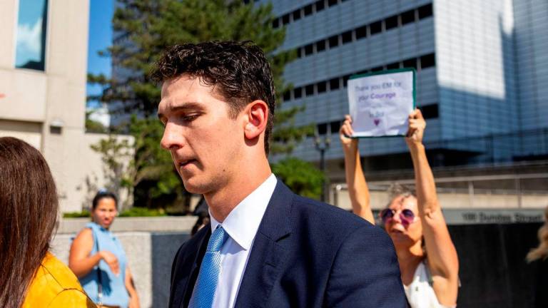 Cal Foote leaves court after a judge found him and his teammates not guilty in the trial involving players from Canada’s 2018 gold medal–winning world junior hockey team, who were charged with sexually assaulting a woman in a hotel room, at the Superior Court of Justice in London, Ontario, Canada, July 24, 2025- REUTERS