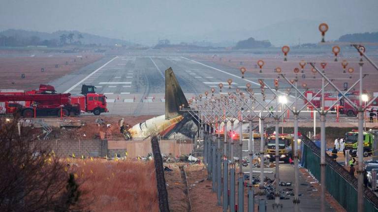 The wreckage of the Jeju Air aircraft that went off the runway and crashed lies at Muan International Airport, in Muan, South Korea, December 30, 2024. - REUTERSPIX