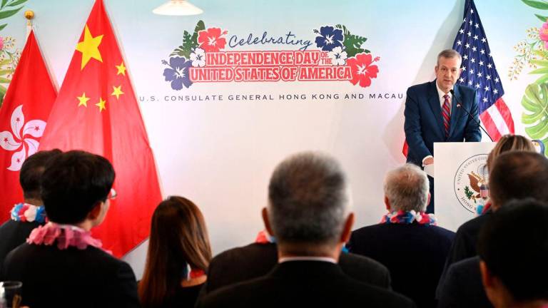 US Consul General Gregory May (R) speaks at a reception held by the US Consulate in Hong Kong to celebrate its upcoming July 4th Independence Day anniversary on June 26, 2025. (Photo by Peter PARKS / AFP)