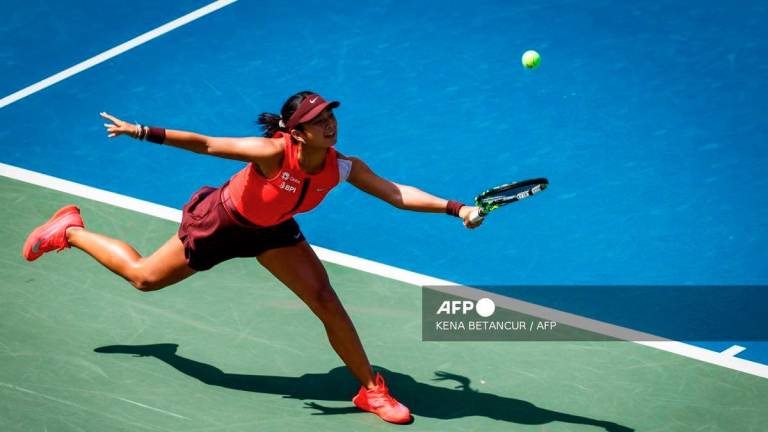 Philippines' Alexandra Eala plays a return to Denmark's Clara Tauson during their women's singles first round tennis match on day one of the US Open tennis tournament at the USTA Billie Jean King National Tennis Center in New York City, on August 24, 2025. - AFP