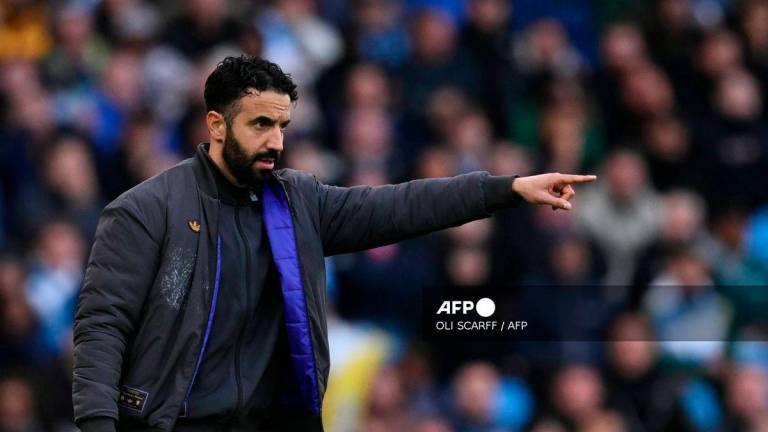 Manchester United's Portuguese head coach Ruben Amorim gestures on the touchline during the English Premier League football match between Manchester City and Manchester United at the Etihad Stadium in Manchester, north west England, on September 14, 2025. - AFP