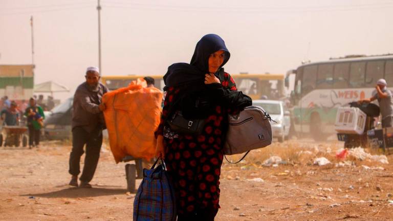 Afghan refugees arrive from Iran at Islam Qala border between Afghanistan and Iran, on July 5, 2025. (Photo by Mohsen KARIMI / AFP)