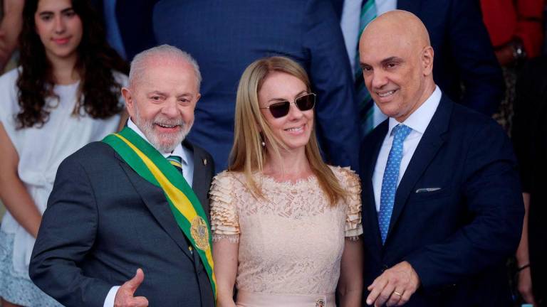 Brazil's President Luiz Inacio Lula da Silva poses for a picture with Brazil's Supreme Court Judge Alexandre de Moraes and his wife Viviane Barci de Moraes during the Independence Day parade in Brasilia, Brazil September 7, 2024. - REUTERSPIX