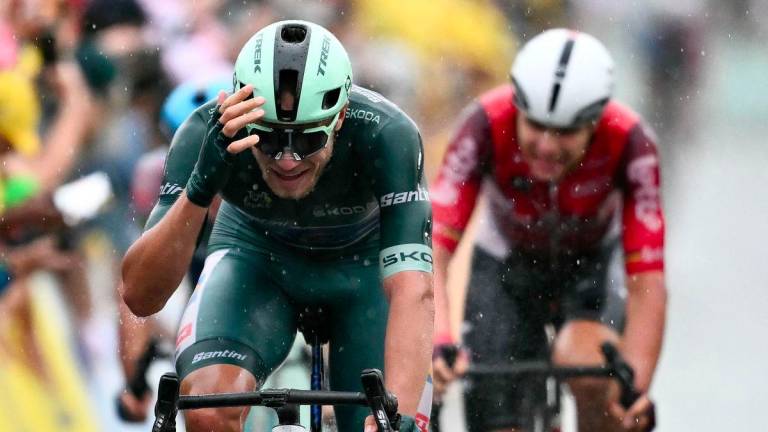 Trek team's Italian rider Jonathan Milan wearing the best sprinter's green jersey cycles to the finish line to win the 17th stage of the 112th edition of the Tour de France cycling race, 160.4 km between Bollene and Valence, southern France, on July 23, 2025. - AFPPIX