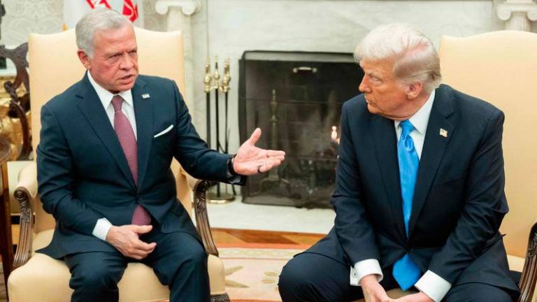 US President Donald Trump (R) meets with King Abdullah II of Jordan during a meeting in the Oval Office of the White House in Washington, DC, on February 11, 2025. - AFPPIX