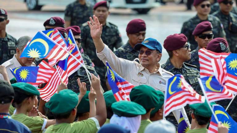 Prime Minister Datuk Seri Anwar Ibrahim extended his congratulations to the human graphic performance team, which was made up of 2,000 students from 50 secondary schools in the Federal Territories and Selangor, during the 2025 National Day celebration at Dataran Putrajaya today. - BERNAMA