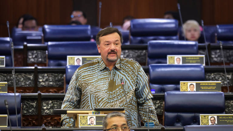 Second Finance Minister Datuk Seri Amir Hamzah Azizan speaks during the Second Meeting of the Fourth Session of the 15th Parliament at the Parliament Building today. – BERNAMA