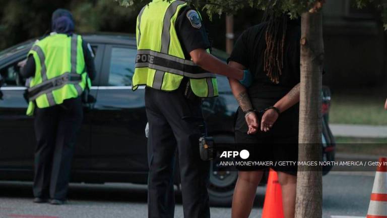U.S. Federal Bureau of Investigation (FBI) and Metropolitan Police Department (MPD) detain a person as they conduct a traffic stop near the Navy Yard neighborhood on August 15, 2025 in Washington, DC. - Getty Images via AFP
