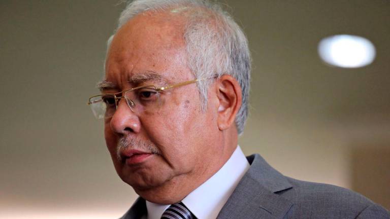 Former Malaysian Prime Minister Najib Razak reacts during a break at Kuala Lumpur High Court in Kuala Lumpur, Malaysia, February 5, 2020. - REUTERS