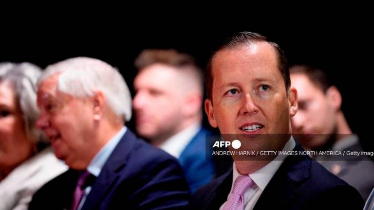 Assistant to the President Sergio Gor (R), accompanied by Sen. Lindsey Graham (R-SC) (L), waits before U.S. President Donald Trump arrives for an event at the Kennedy Center on August 13, 2025 in Washington, DC. - Getty Images via AFP