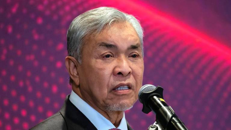Deputy Prime Minister Datuk Seri Dr Ahmad Zahid delivers a speech at the NurAI launch event in conjunction with the ASEAN Malaysia 2025 AI Summit at Four Seasons Hotel Kuala Lumpur today. - BERNAMA