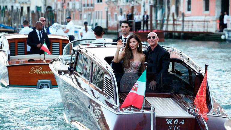 Amazon founder Jeff Bezos and his wife Lauren Sanchez Bezos travel on a boat, as they leave Aman Venice hotel, on the third day of their wedding festivities, in Venice, Italy, June 28, 2025. REUTERS/Guglielmo Mangiapane