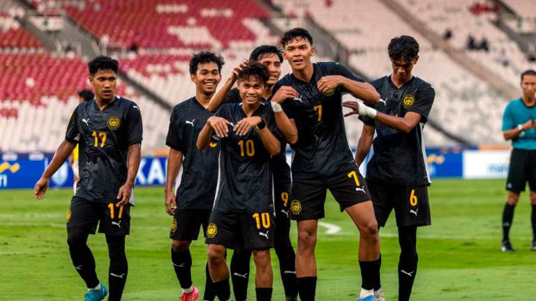 Malaysia team after their match against Brunei Darussalam at Stadium Gelora Bung Karno, yesterday - BERNAMA