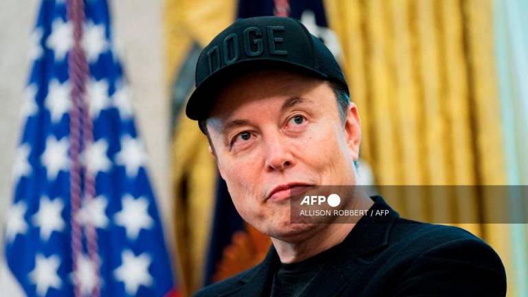 (FILES) Elon Musk looks on during a news conference with US President Donald Trump in the Oval Office of the White House in Washington, DC, on May 30, 2025. - AFP