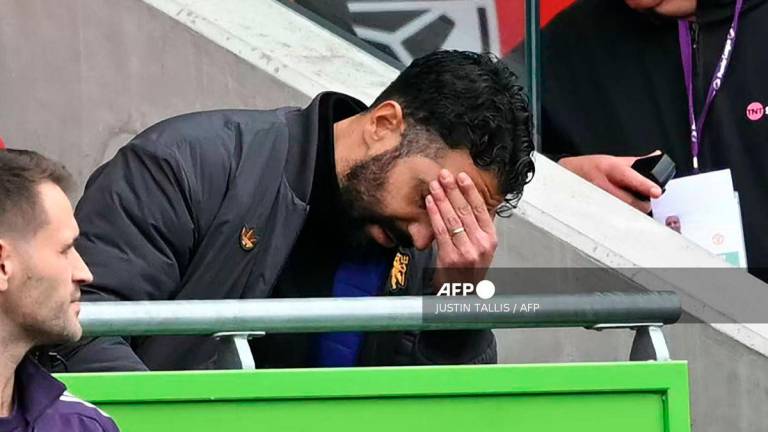 Manchester United's Portuguese head coach Ruben Amorim reacts in his seat during the English Premier League football match between Brentford and Manchester United at the Gtech Community Stadium in London on September 27, 2025. - AFP