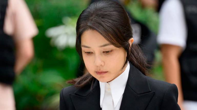 South Korea’s former first lady Kim Keon Hee, wife of impeached former president Yoon Suk Yeol, arrives at the special prosecutor’s office in Seoul on August 6, 2025. (Photo by ANTHONY WALLACE / AFP)