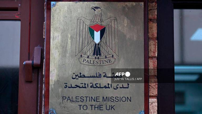A sign is seen outside the Palestine Mission to the UK on September 21, 2025 in west London. UK Prime Minister Keir Starmer on Sunday said Britain was formally recognising a State of Palestine, in a historic shift in decades of British foreign policy. - AFP
