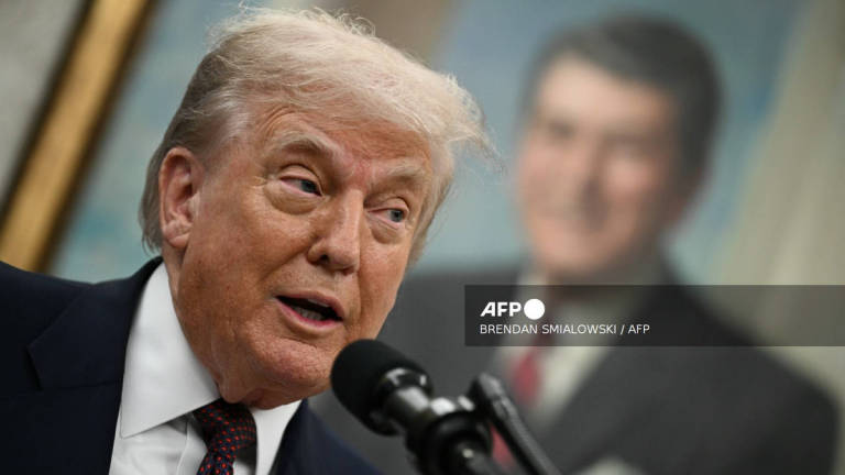 US President Donald Trump speaks in the Oval Office of the White House in Washington, DC, on August 6, 2025 to announce that Apple will invest an additional $100 billion in the United States, taking its total pledge to $600 billion over the next four years. - AFP