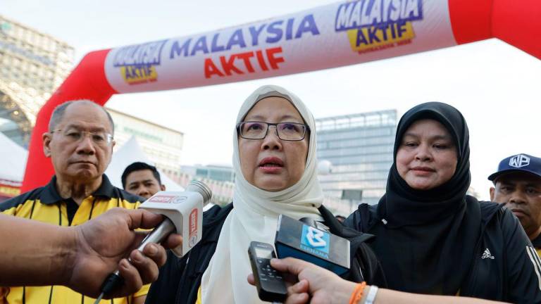 Minister in the Prime Minister’s Department (Federal Territories) Datuk Seri Dr Zaliha Mustafa speaking to members of the media after flagging off participants of the FT Run Putrajaya 2025 at Dataran Putrajaya today. – BERNAMA