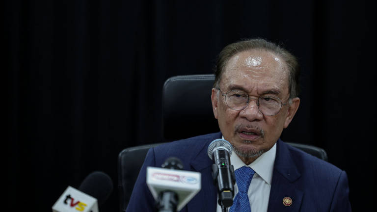 Prime Minister Datuk Seri Anwar Ibrahim speaks at a press conference after paying a courtesy visit to the ASEAN Secretariat today. – BERNAMA