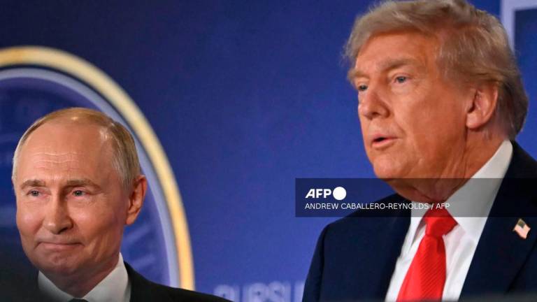 US President Donald Trump (R) and Russian President Vladimir Putin stand together after delivering a joint press conference after participating in a US-Russia summit on Ukraine at Joint Base Elmendorf-Richardson in Anchorage, Alaska, on August 15, 2025. - AFP