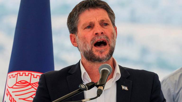 Israeli Finance Minister Bezalel Smotrich speaks at a press conference regarding settlements expansion for the long-frozen E1 settlement, that would split East Jerusalem from the occupied West Bank, near the Israeli settlement of Maale Adumim in the Israeli-occupied West Bank, August 14, 2025. - REUTERS/Ronen Zvulun