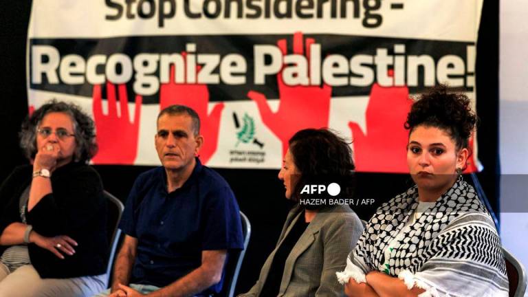 Israeli left-wing activists attend a press conference under the Partnership for Peace: Yes to Recognition slogan, in support of international recognition of Palestine, in Jerusalem on September 21, 2025. - AFP