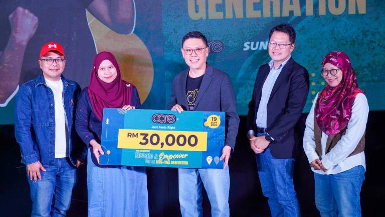 Nur Afiqah (second from left) during an event to urge critical, pragmatic action to address HIV among youths. – AMIRUL SYAFIQ/THESUN
