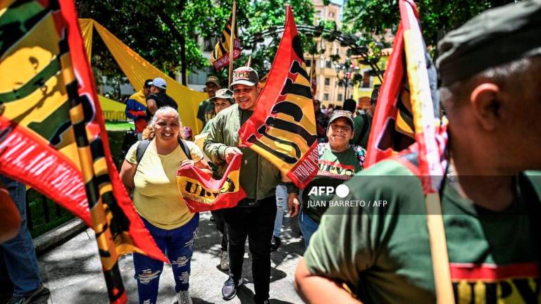 Members of Venezuelan Popular Unity (Unidad Popular Venezolana-UPV) take part in the national enlistment campaign called by the government of President Nicolas Maduro at Bolivar square in Caracas, on August 23, 2025. - AFP