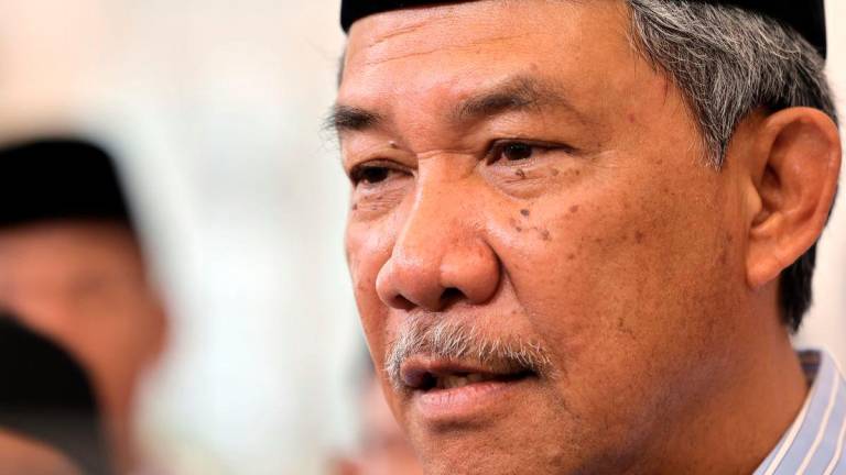 Menteri Luar merangkap Ahli Parlimen Rembau Datuk Seri Mohamad Hasan ketika ditemui media selepas menghadiri Karnival Mawlid Masjid Sheikh Haji Ahmad hari ini. - BERNAMA