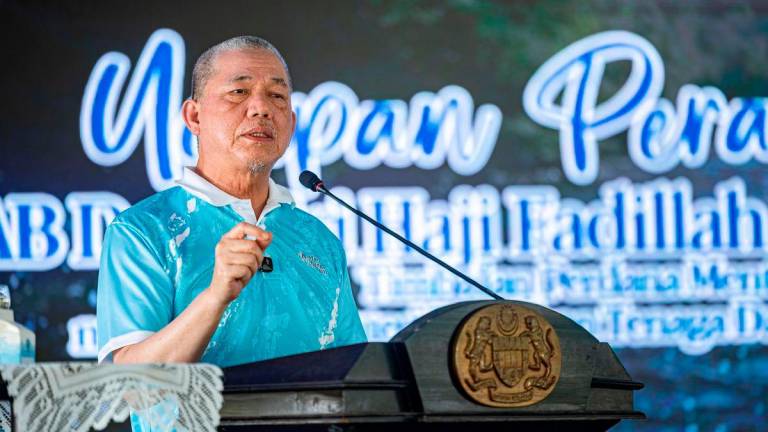 Deputy Prime Minister and also Minister of Energy Transition and Water Transformation, Datuk Seri Fadillah Yusof, delivering a speech at the launch of the 2025 National-level World Rivers Day Celebration at Sungai Batu Tegoh today. – BERNAMA