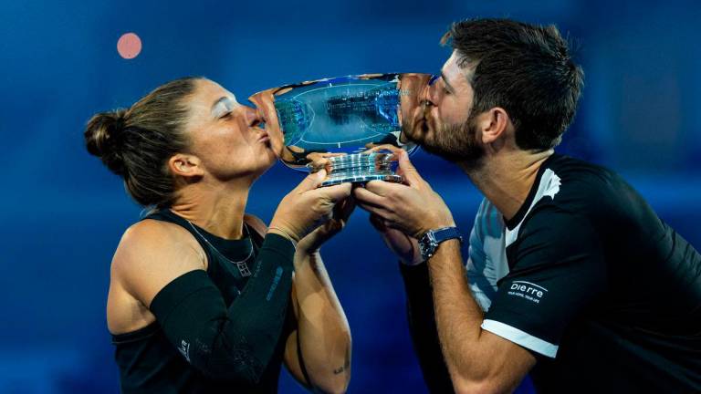 Sara Errani of Italy and Andrea Vavassori of Italy pose with the winner’s trophy after their victory over Casper Ruud of Norway and Ina Swiatek of Poland who pose with the runner up’s trophy after the final of the mixed doubles tournament at the US Open at Arthur Ashe Stadium. : Mike Frey-Imagn Images - REUTERS