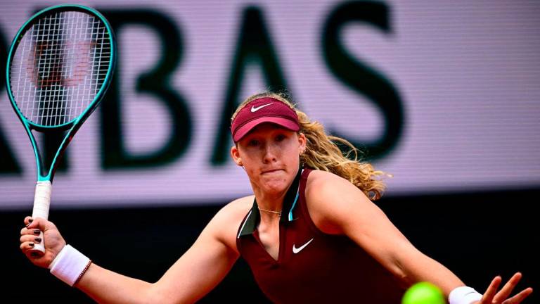 Russia’s Mirra Andreeva plays a forehand return to Australia’s Daria Kasatkina during their women’s singles match on day 9 of the French Open tennis tournament on Court Suzanne-Lenglen at the Roland-Garros Complex in Paris on June 2, 2025. (Photo by JULIEN DE ROSA / AFP)