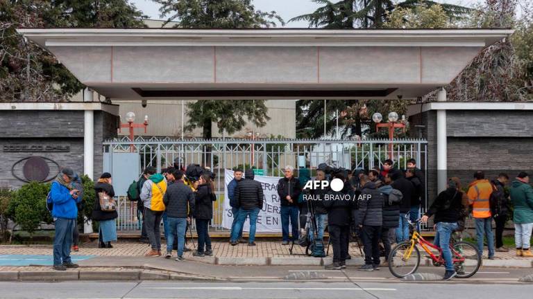 Relatives of the injured miners wait for information at Codelco headquarters in Rancagua, O'Higgins Region, Chile, on August 1, 2025. At least one worker was killed and five others were missing after a copper mine collapse in Chile triggered by an earthquake on July 31, 2025, state-owned operator Codelco said. - Raul BRAVO / AFP