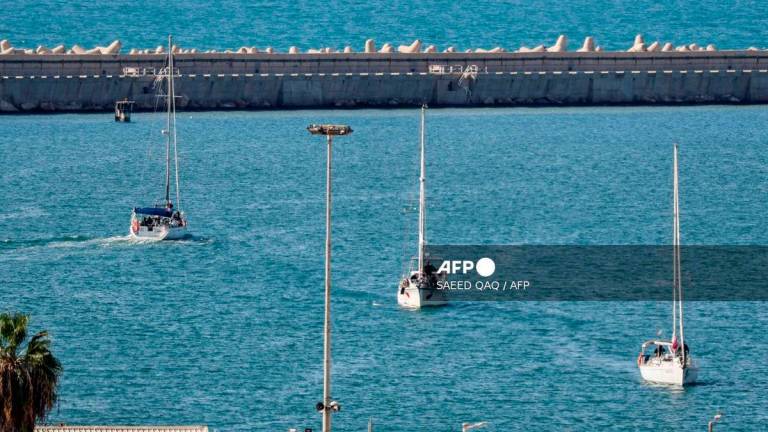 Boats from the Global Sumud Flotilla intercepted by Israeli forces in the Mediterranean sea off the Gaza Strip waters, arrive in the southern port of Ashdod on October 2, 2025. (Photo by Saeed QAQ / AFP)