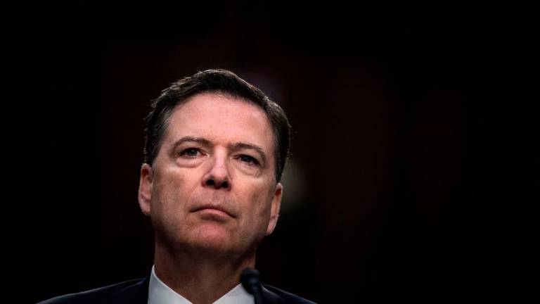 Ousted FBI director James Comey listens during a hearing before the Senate Select Committee on Intelligence on Capitol Hill June 8, 2017 in Washington,