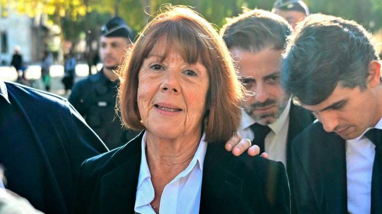 Gisele Pelicot looks on as she exits the courthouse during the appeal trial in the Mazan rape case at the Nimes courthouse in Nimes, southern France, on October 8, 2025. (Photo by Christophe Simon / AFP)