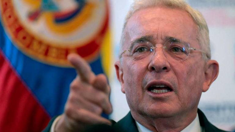 Colombian former president (2002–2010) Alvaro Uribe gesturing in a press conference after testifying over a 1997 massacre at the Attorney General's Office in Bogota, on November 27, 2023. - AFPPIX