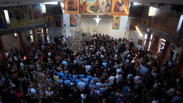 Worshippers gather for a mass led by the Greek Orthodox Patriarch of Antioch at the Saint Elias Church, the day after a suicide attack on this religious site, in Damascus’ Dwelaa area, on June 23, 2025. (Photo by Bakr ALKASEM / AFP)