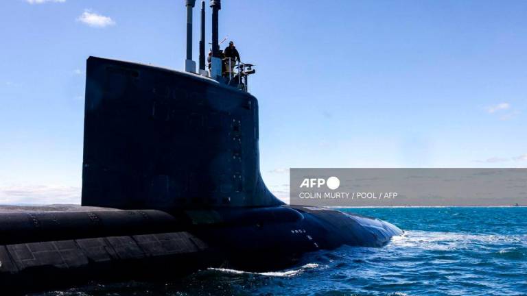 (FILES) The US Navy’s USS Minnesota (SSN-783), a Virginia-class fast attack submarine, sails in waters off the coast of Western Australia on March 16, 2025. (Photo by COLIN MURTY / POOL / AFP)