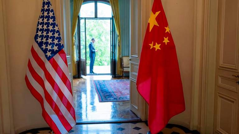 The U.S. and Chinese flags are seen on the day of a bilateral meeting between the U.S. and China, in Geneva, Switzerland, May 10, 2025. KEYSTONE/EDA/Martial Trezzini/Handout via REUTERS/File photo