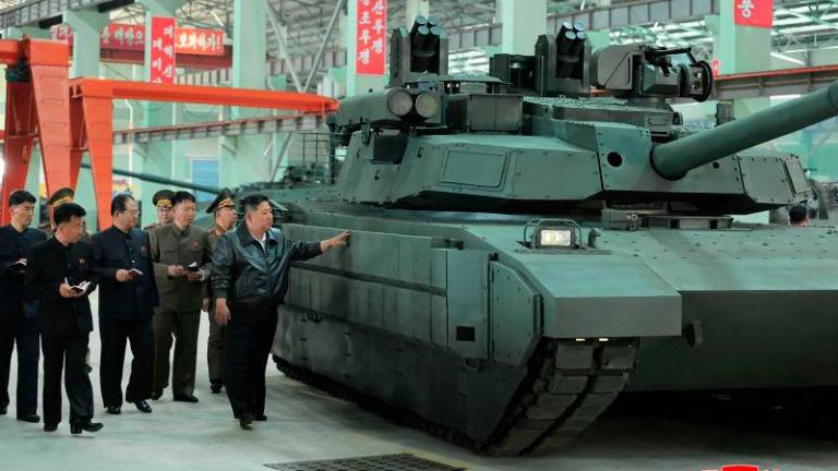 This undated picture released from North Korea’s official Korean Central News Agency (KCNA) on May 4, 2025 shows North Korean leader Kim Jong Un inspecting a tank factory in an undisclosed location in North Korea. AFPpix