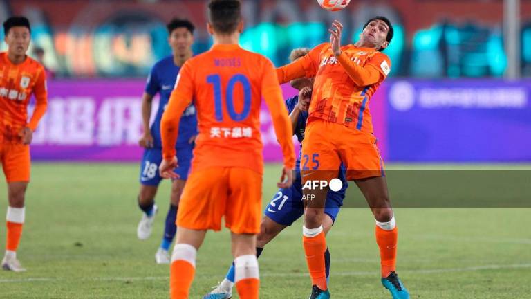Shandong Taishan’s Marouane Fellaini (R) fights for the ball during their 2023 Chinese Football Association (CFA) Supercup football match with Wuhan Three Towns FC in Hangzhou. - AFPpix