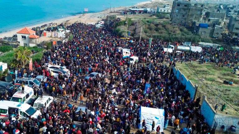 Displaced Gazans gathering in an area in Nuseirat to return to their homes in the northern part of the Gaza Strip - AFPpix