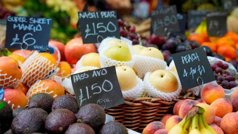FILE PHOTO: Prices of food are displayed at the Borough Market as the UK inflation rates fall by less than expected in London, Britain May 22, 2024. REUTERS/Maja Smiejkowska/File Photo