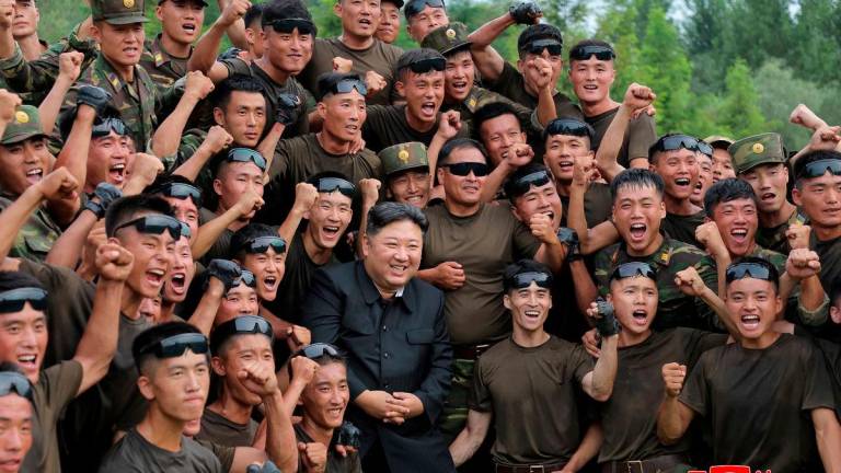North Korean leader Kim Jong Un poses for a photo with troops during a visit to a special operation training base at an undisclosed location in this undated picture released by North Korea’s official Korean Central News Agency on August 28, 2025. KCNA via REUTERS