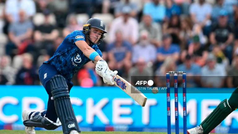 England’s Jacob Bethell swings at a ball from South Africa’s Keshav Maharaj during the third One Day International (ODI) cricket match between England and South Africa at the Utilita Bowl cricket ground, in Southampton, on the south coast of England on September 7, 2025. (Photo by JUSTIN TALLIS / AFP)